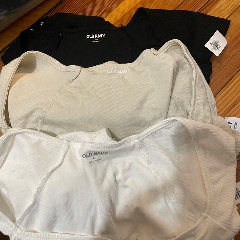 Old Navy Black, Cream, and White Body suits.
